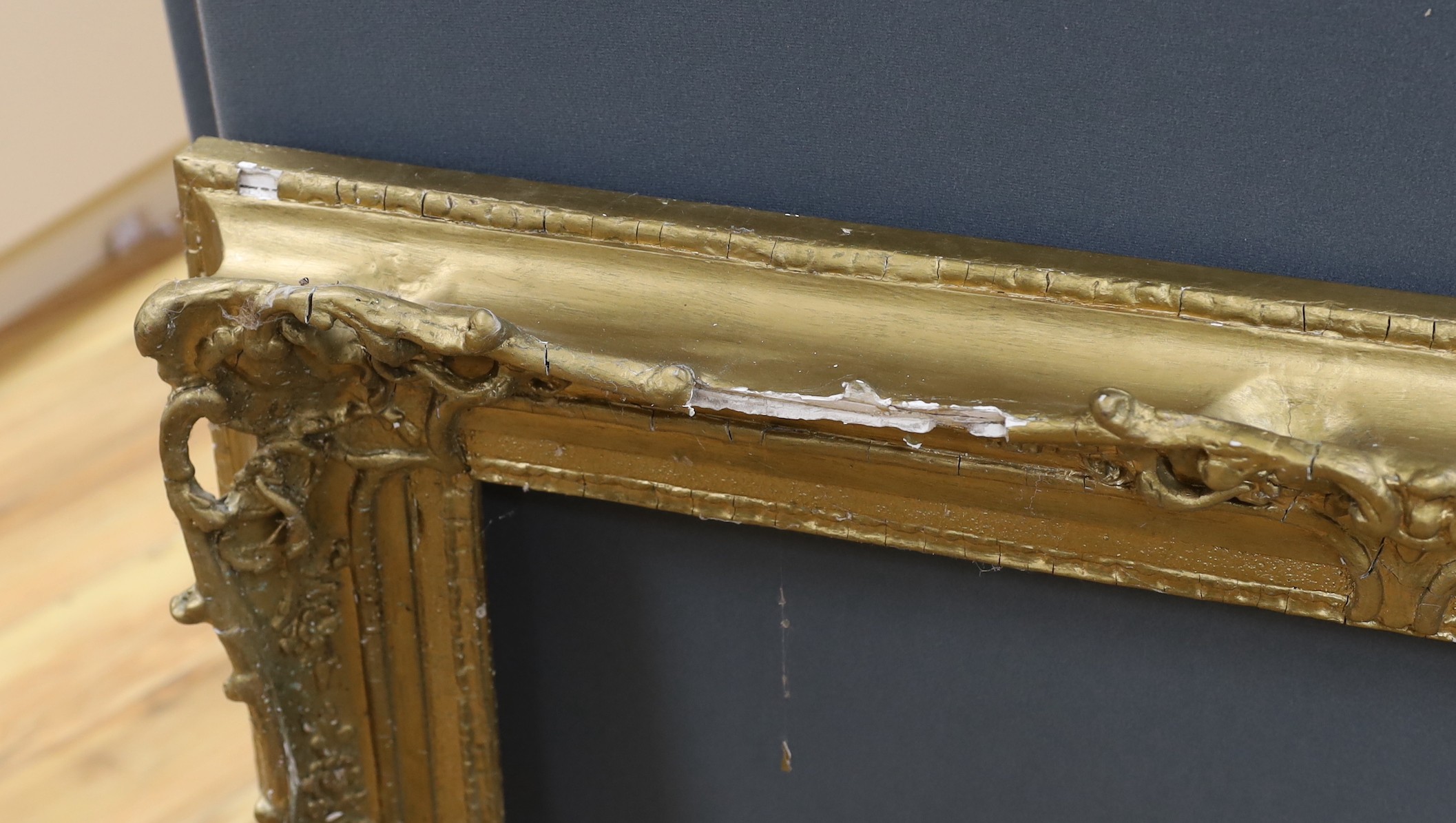 An ornate painted gilt picture frame, 90 x 100cm overall
